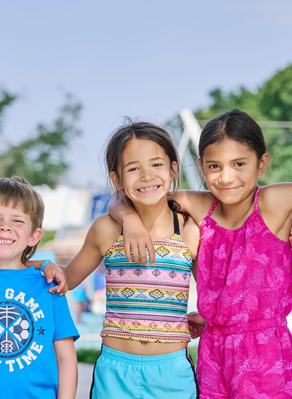 five children with their arms around each others' shoulders at missoula ymca summer camp