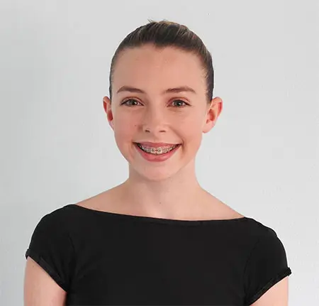 A portrait of a young person wearing a black top.