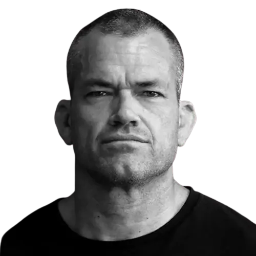 A headshot portrait of an adult man against a white background.