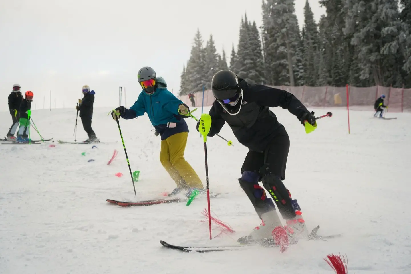 People are practicing skiing on a snowy slope.