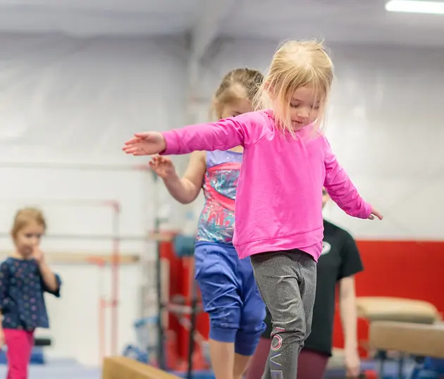 Child Learns to Balance at Movement Preschool