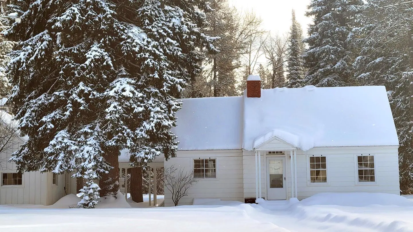 Image of the East Cottage at Savenac in the wintertime, Lolo National Forest, Montana.