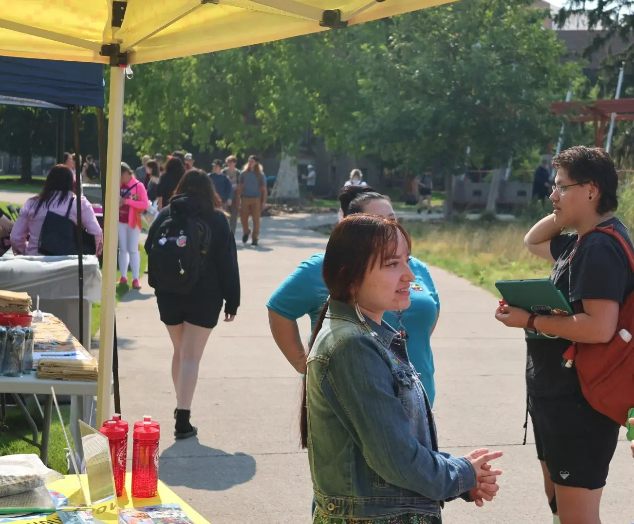 all nations staff talking to passersby