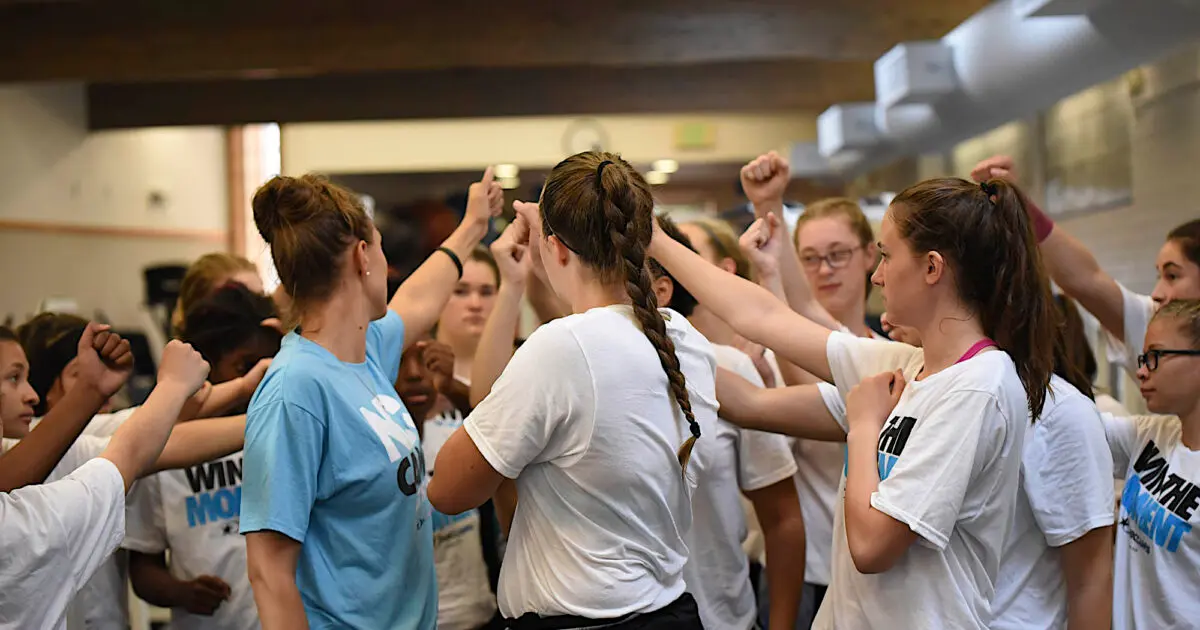 Campers huddle together for all-in commitment