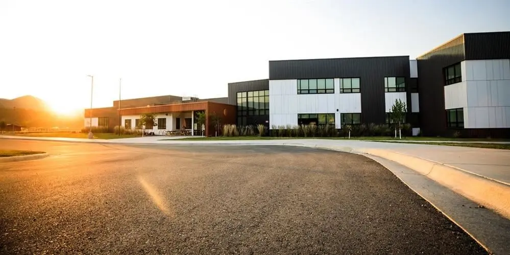 The front of the school at sunset
