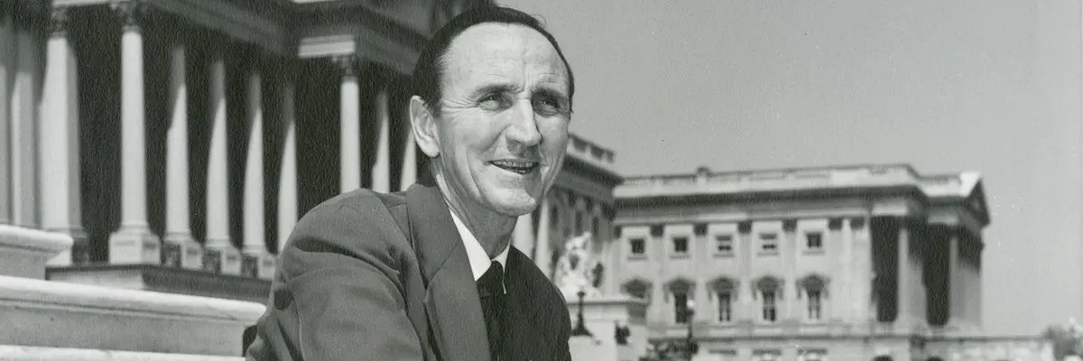 Mike Mansfield sitting on steps of the US capitol building
