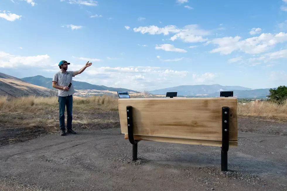 Conservation lands program manager, Jeff Gicklhorn, stands next to one of four benches installed along the new half-mile universal trail that gives users a great bird’s-eye view of the city. (Kevin Moriarty/Missoula Current)