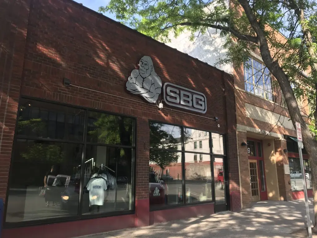 A red brick building features a gorilla mascot and the letters SBG above its front windows.