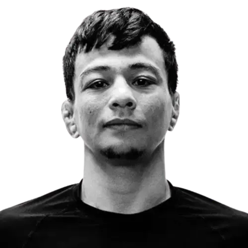A head-and-shoulders portrait of an adult man in a black shirt.