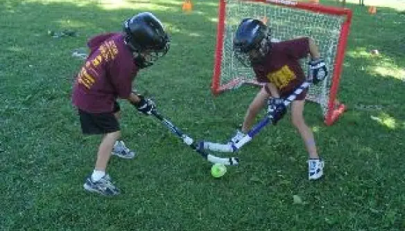 Kids playing field hockey at Hall of Fame Sports Academy