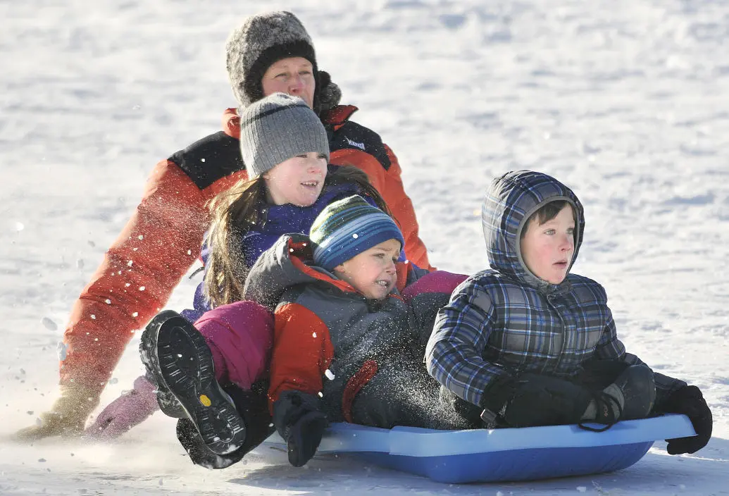 Sunny sledding on a Missoula slope