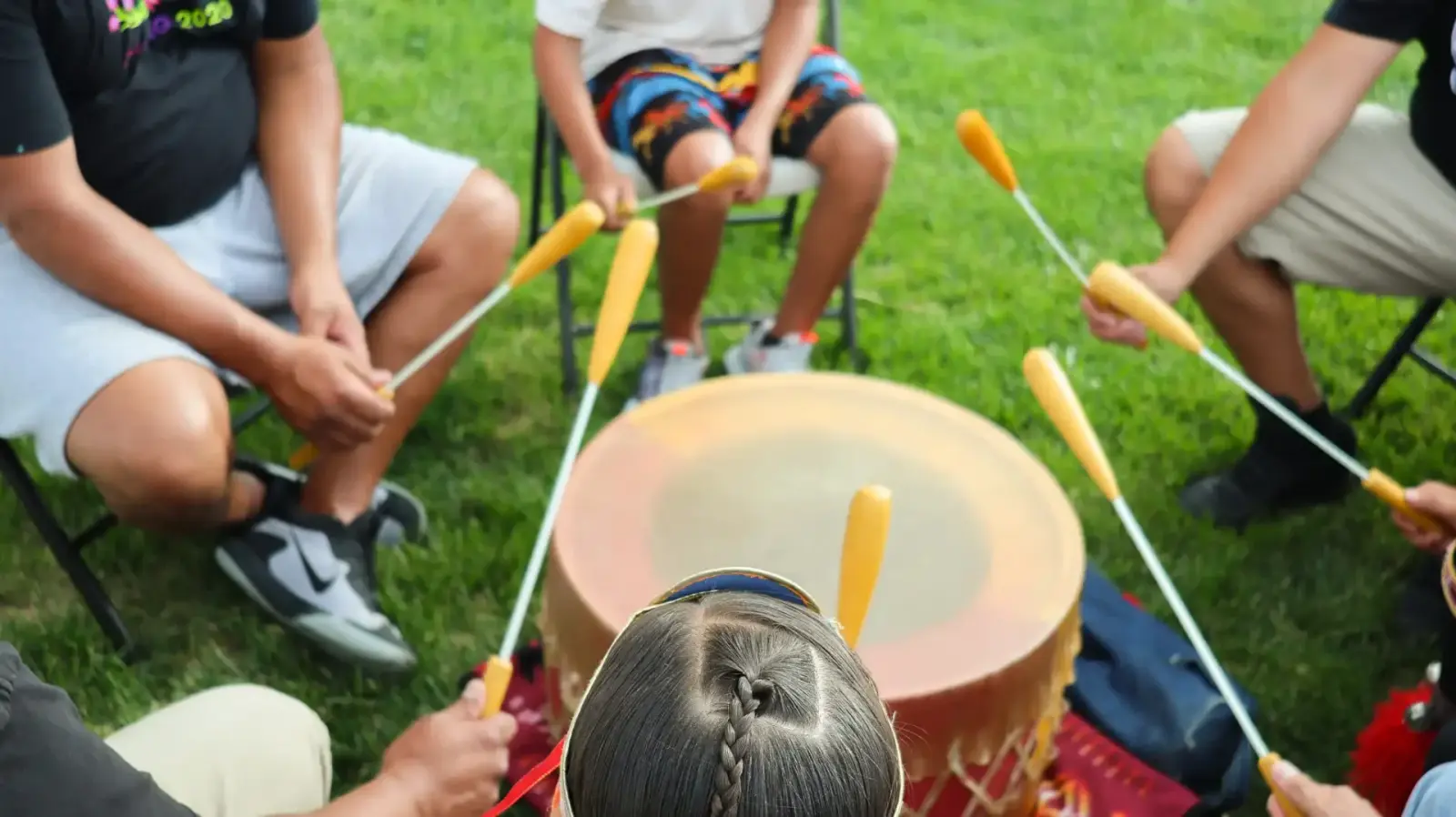 community playing traditional drum