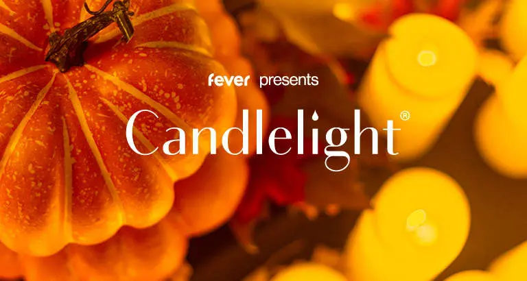 A promotional graphic for a candlelight event featuring a pumpkin and candles.