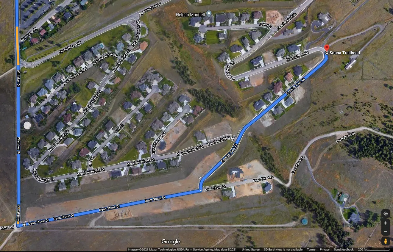 A satellite map view showing a highlighted path to a trailhead in a residential neighborhood.