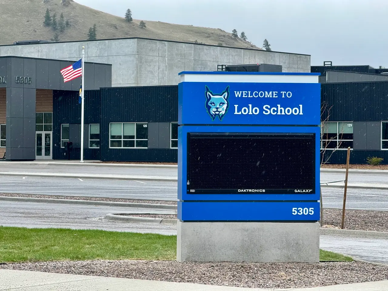 Lolo School from the front including monument sign